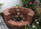 copper Morning Glory water feature in a garden pond - by Gary Pickle of Metallic Garden